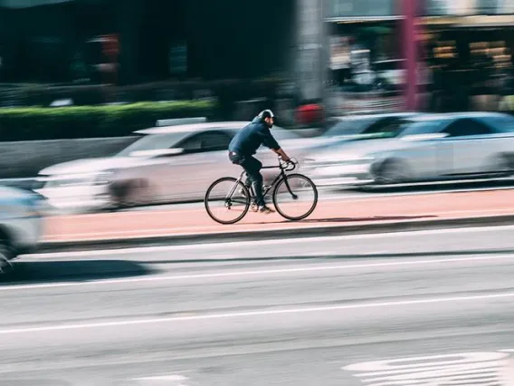 Bicycle and car in traffic