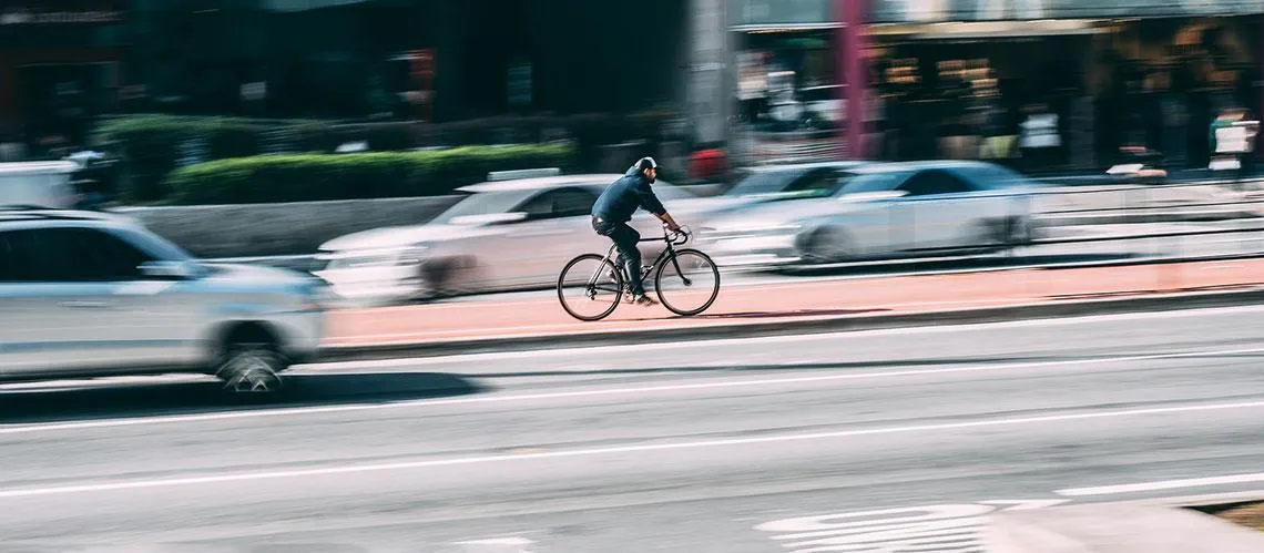 Bicycle and car in traffic